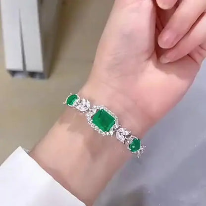 Silver Bracelet and Emerald Stones